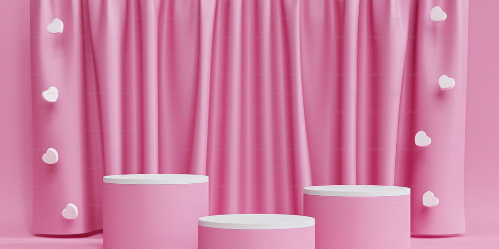 a set of three round stools in front of a pink curtain