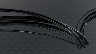 um monte de fios pretos em um fundo cinza