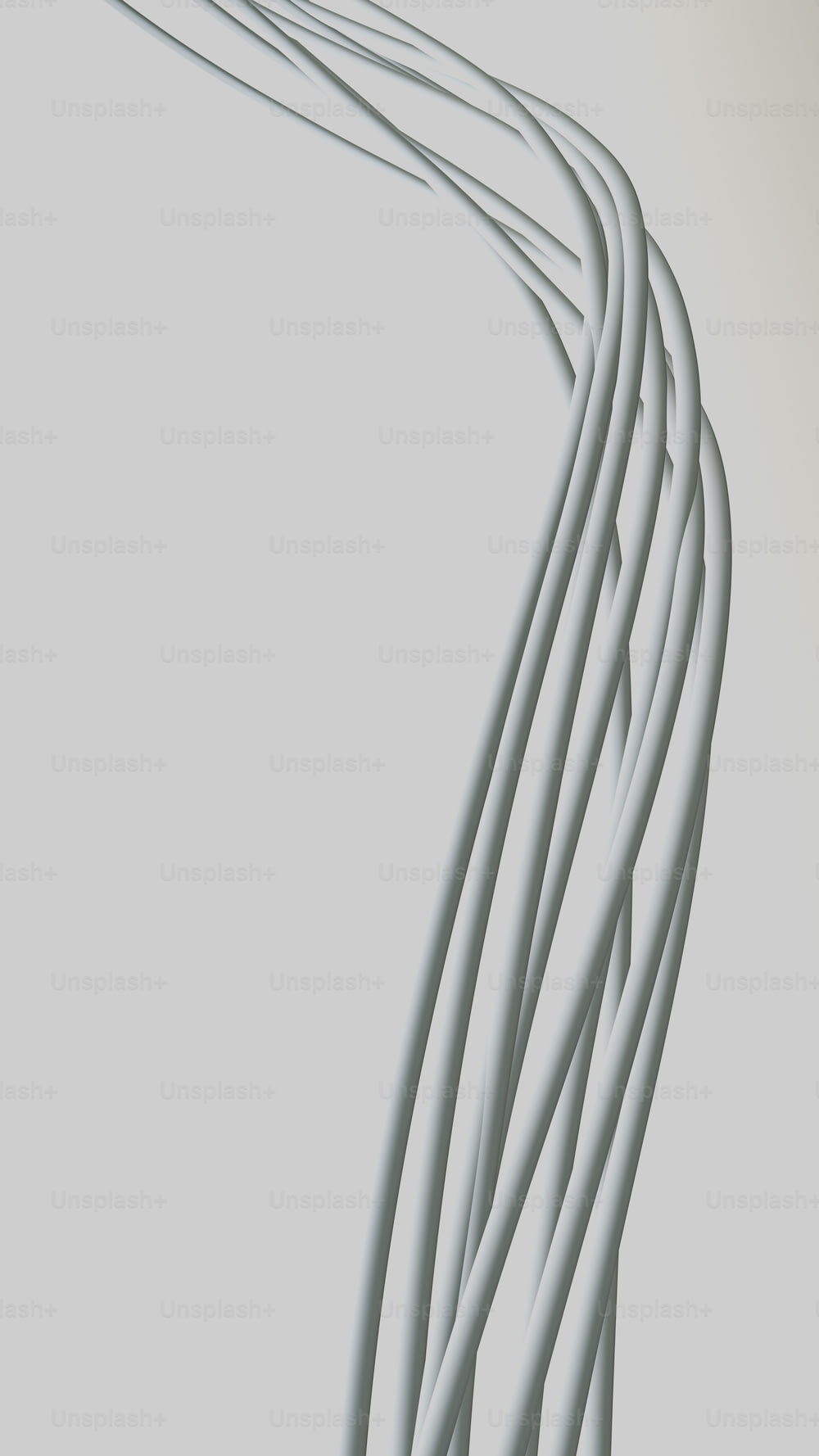 uma longa linha de fios brancos em um fundo cinza