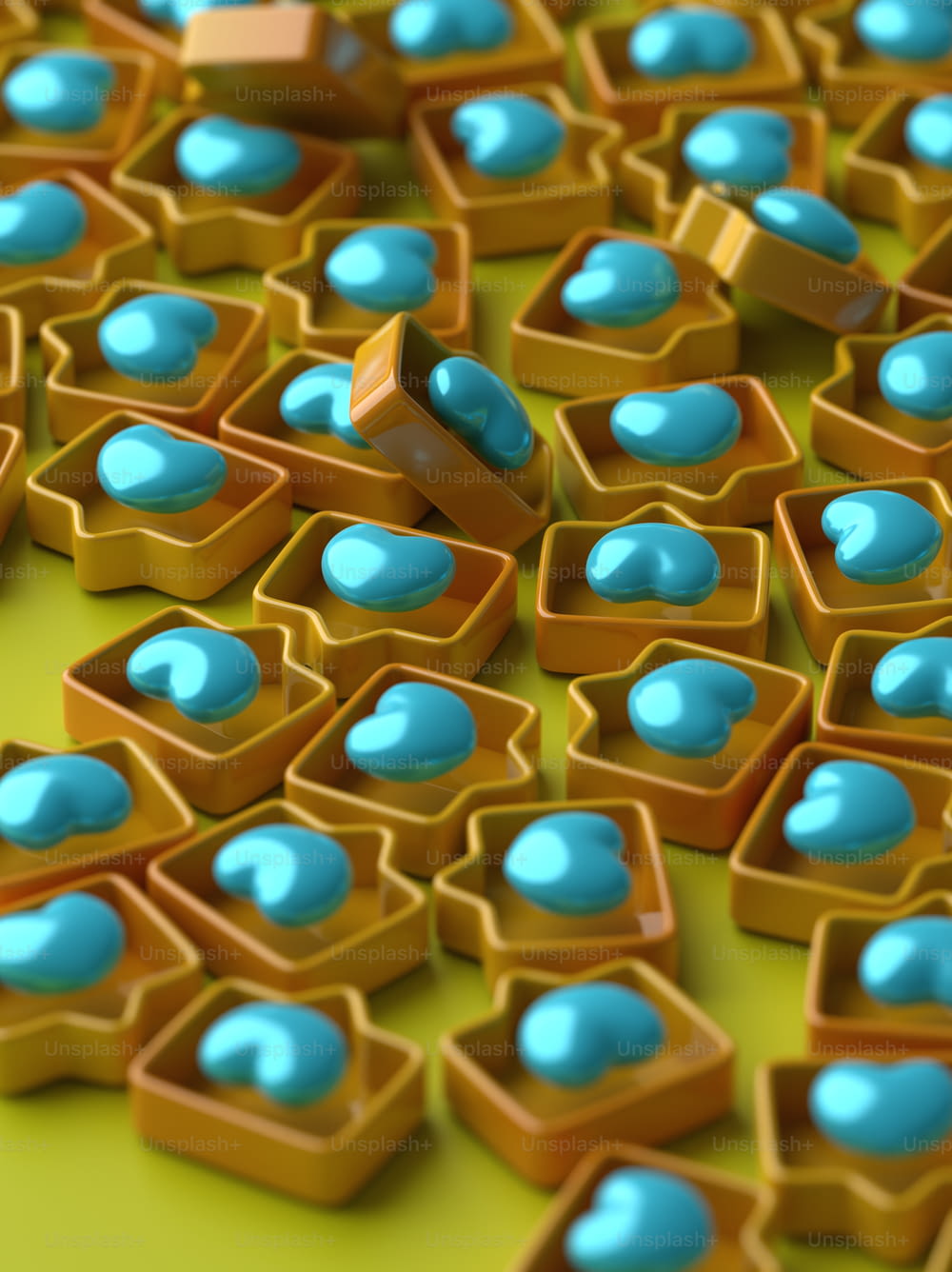 a bunch of blue and yellow candies on a green surface