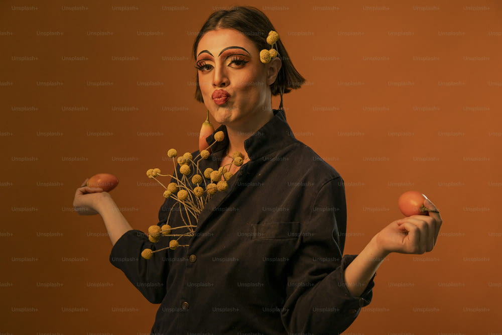 a woman holding a bunch of fruit in her hands