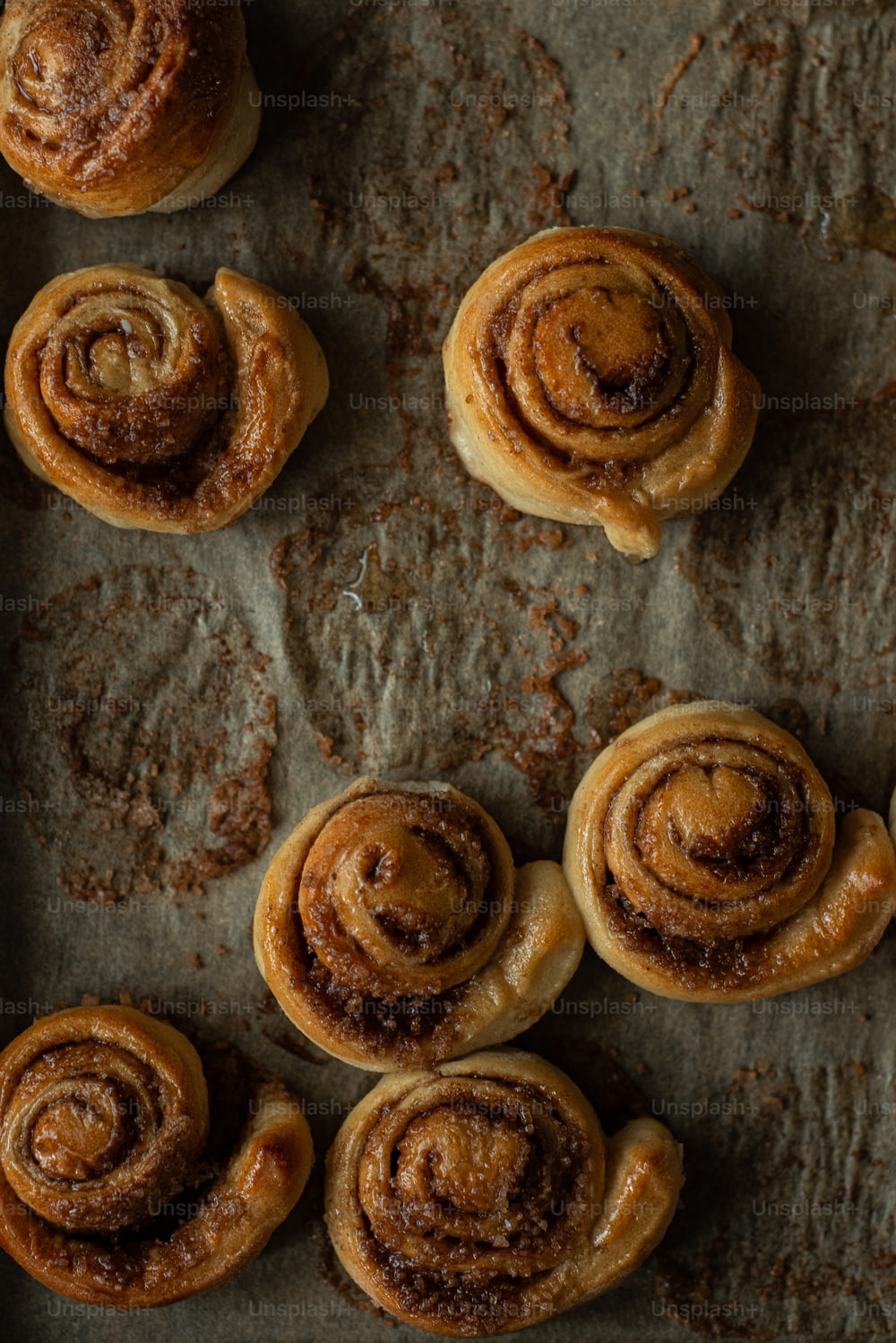 a bunch of cinnamon rolls sitting on top of a pan