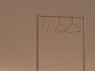 a clothes rack with three hangers on it