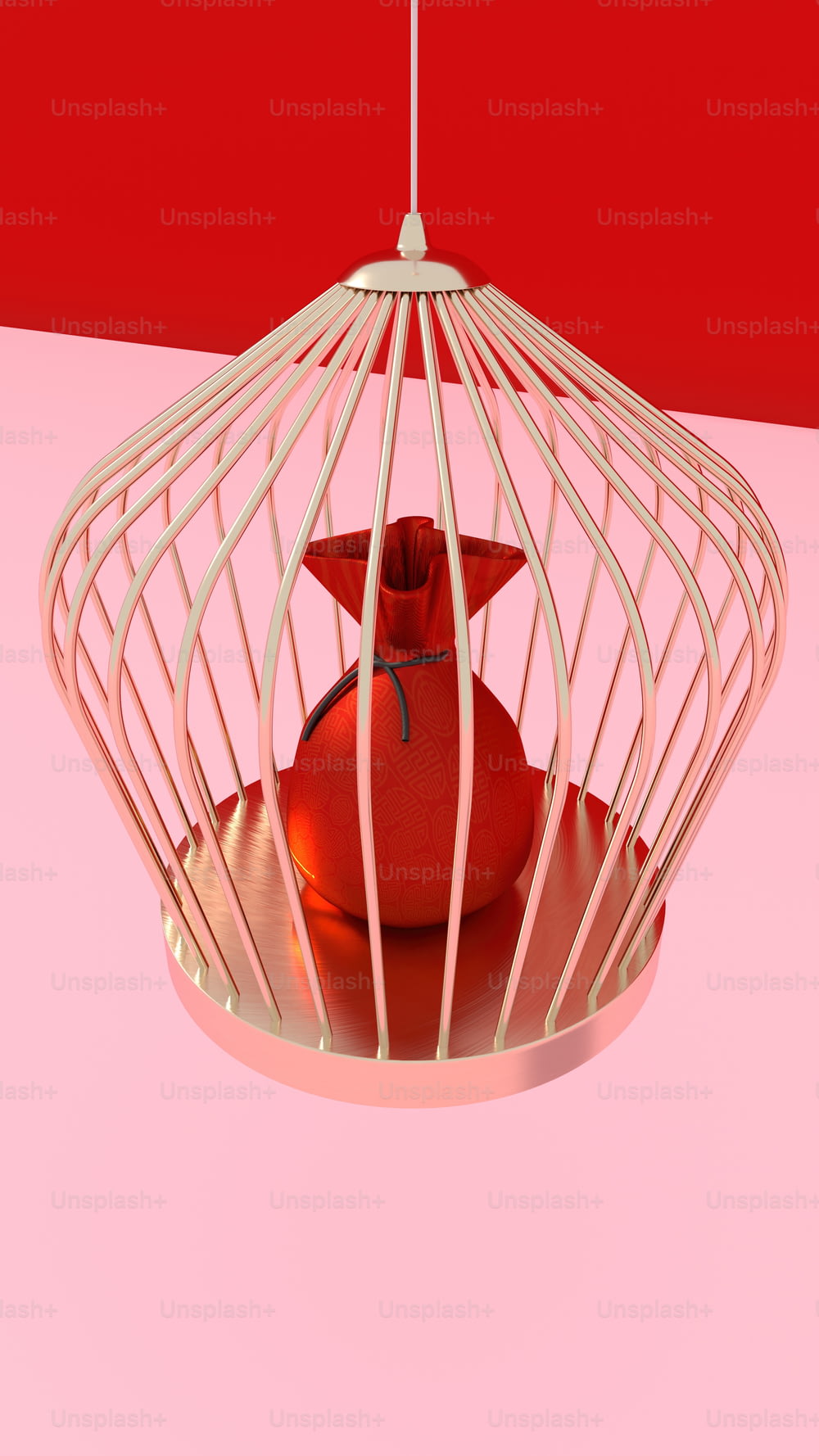a bird in a cage on a pink surface