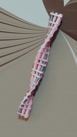 a close up of a pink toothbrush on a beige background