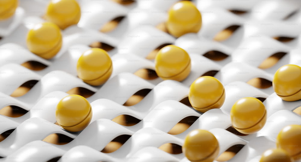 um grupo de bolas amarelas e brancas sentadas uma em cima da outra