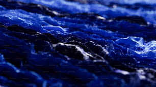a close up of a blue cloth with water droplets on it