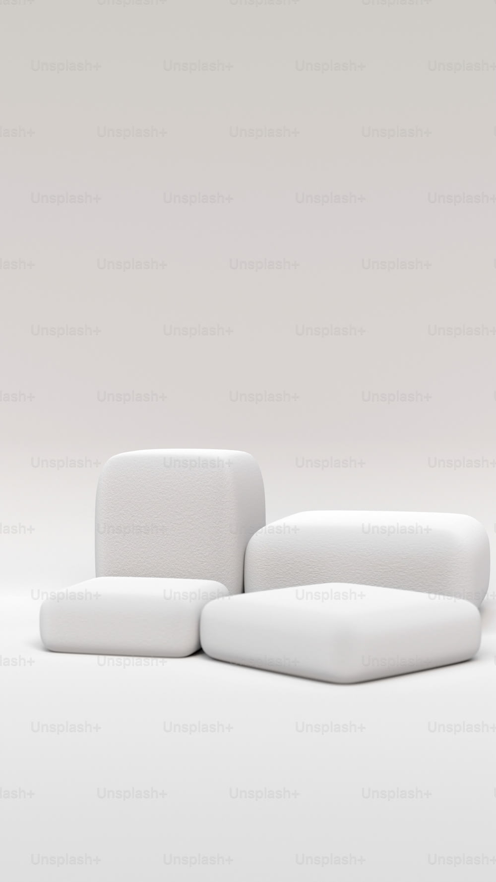 a white couch sitting on top of a white floor