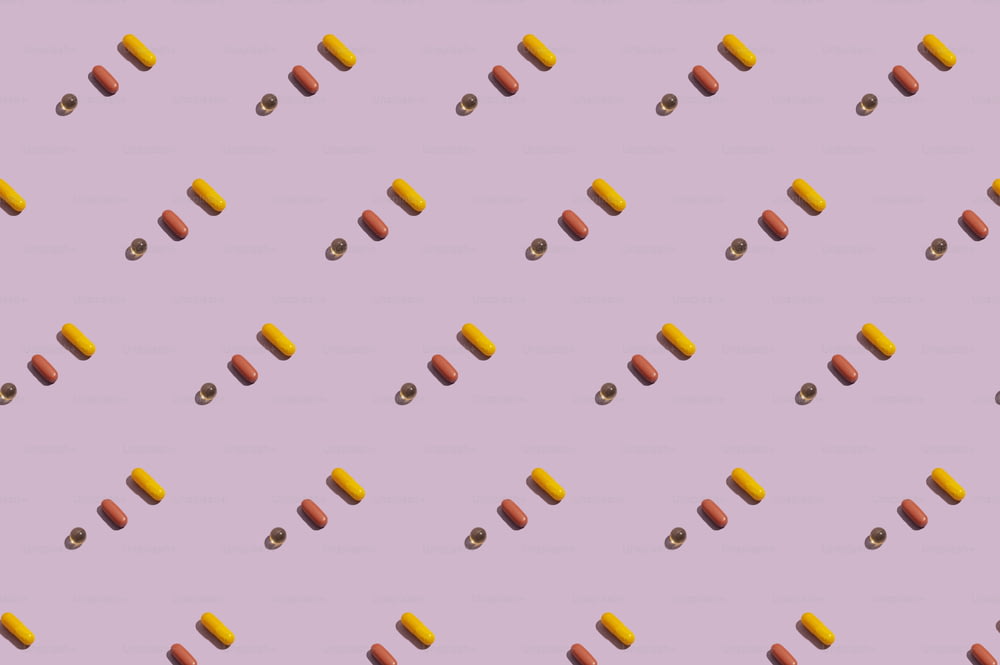 a purple background with a pattern of pills