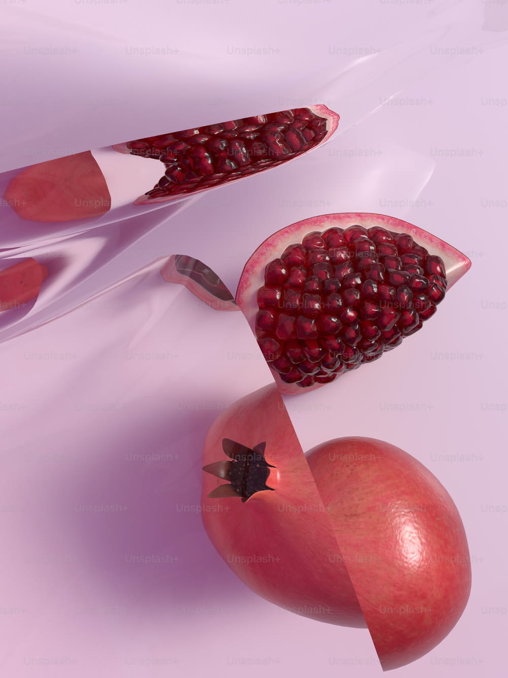 a cut in half pomegranate and a whole pomegranate on