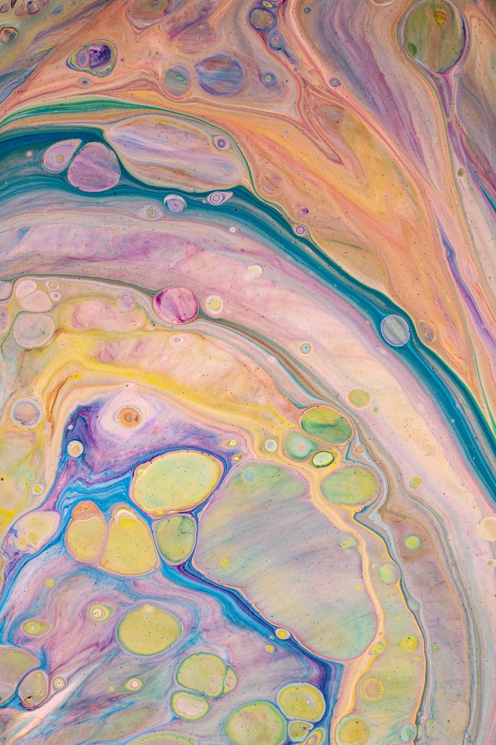 an abstract painting with multicolored paint and bubbles
