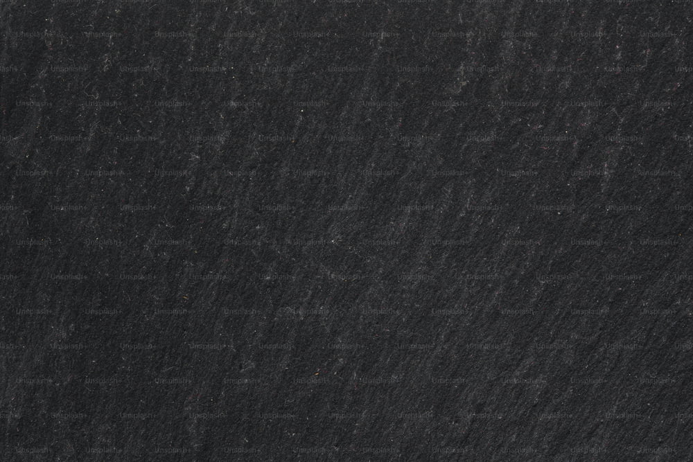 a close up of a black granite surface