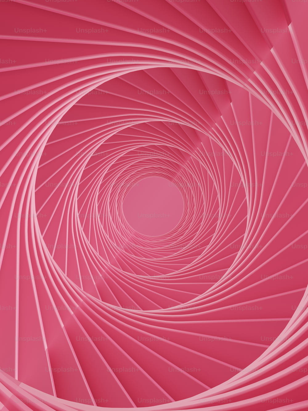 a pink background with a spiral design in the center