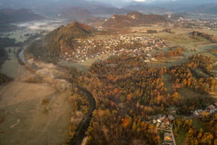 an aerial view of a town surrounded by mountains