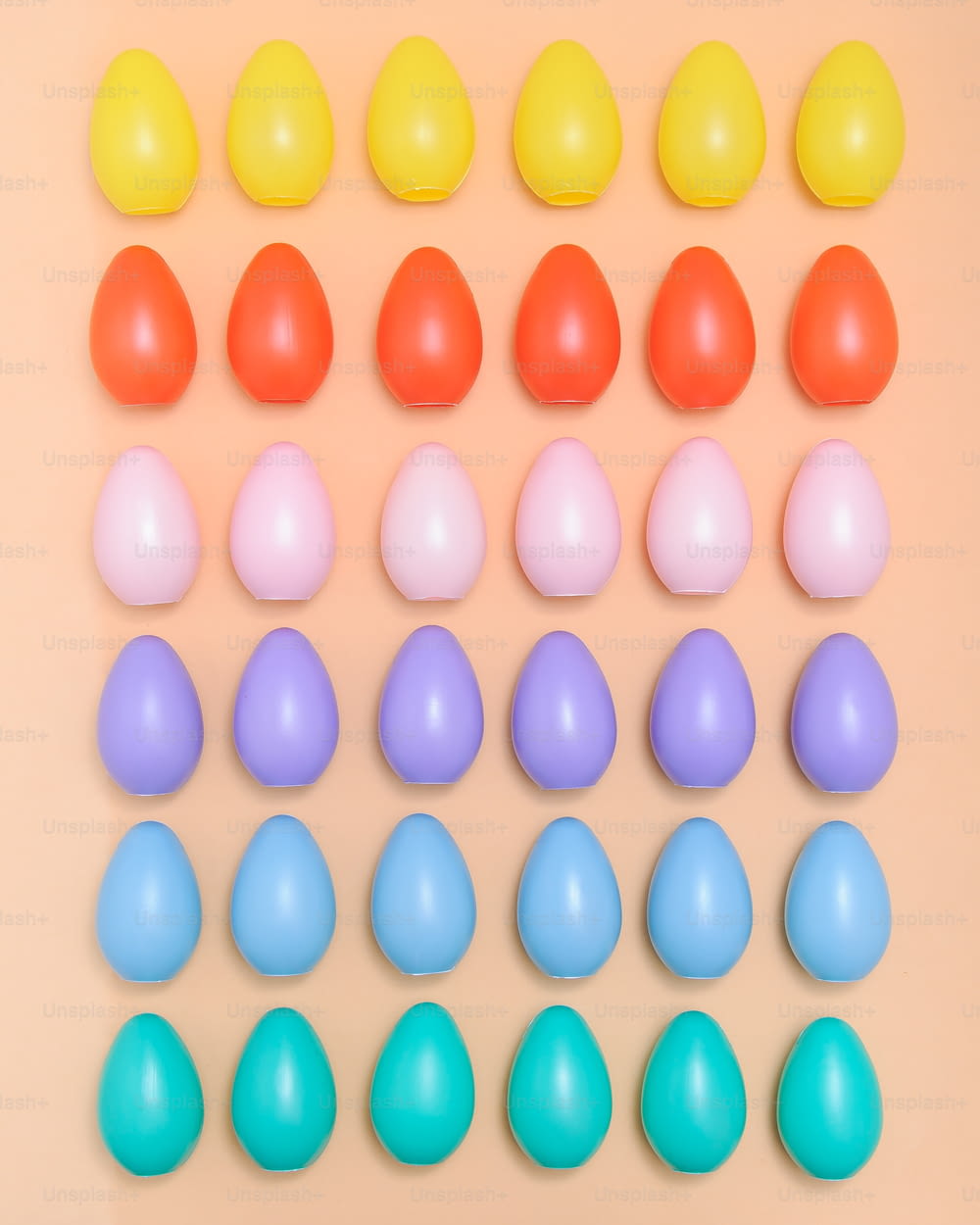 a group of plastic eggs sitting on top of a table