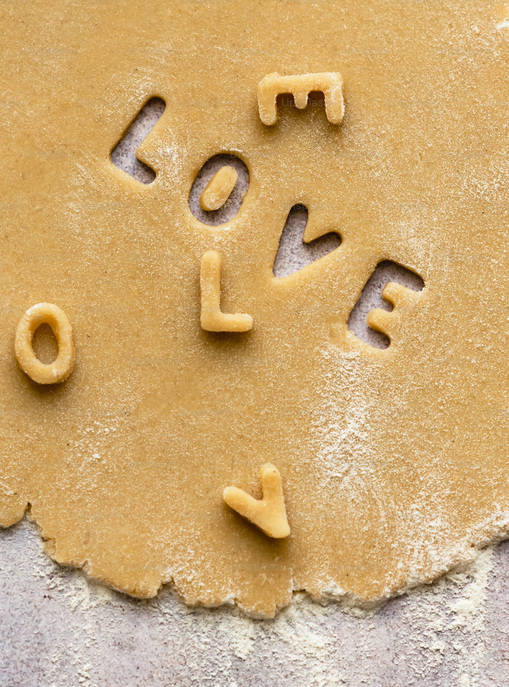 the word love spelled out on the dough