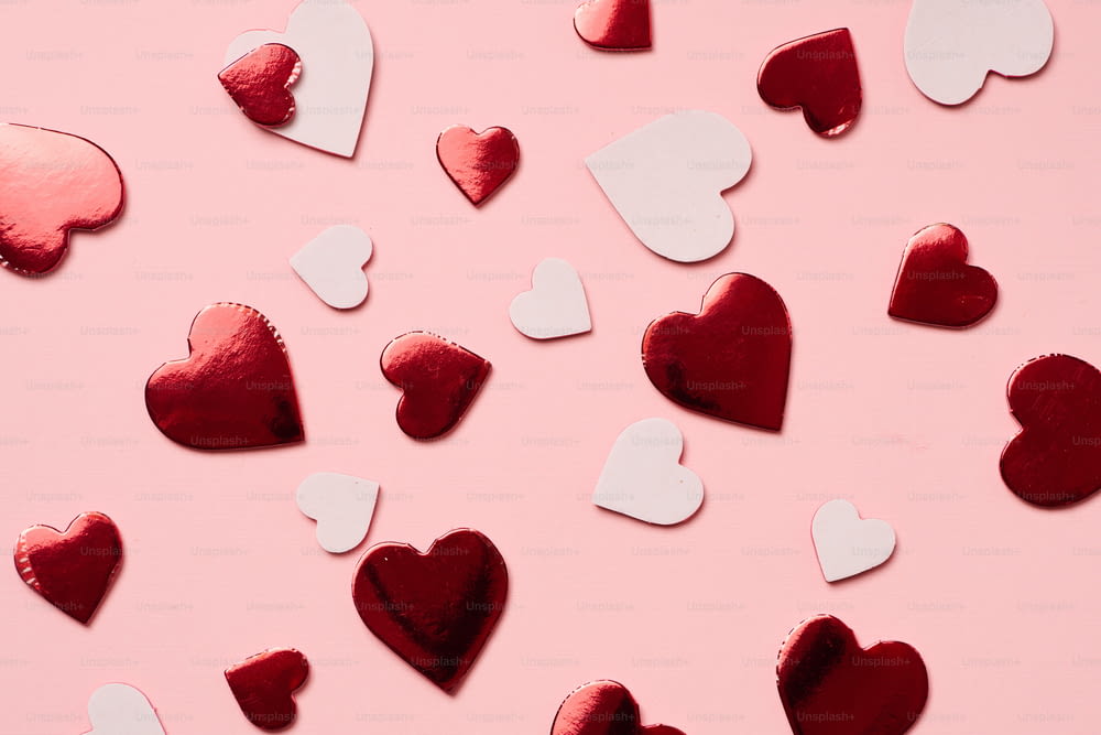red and white hearts on a pink background