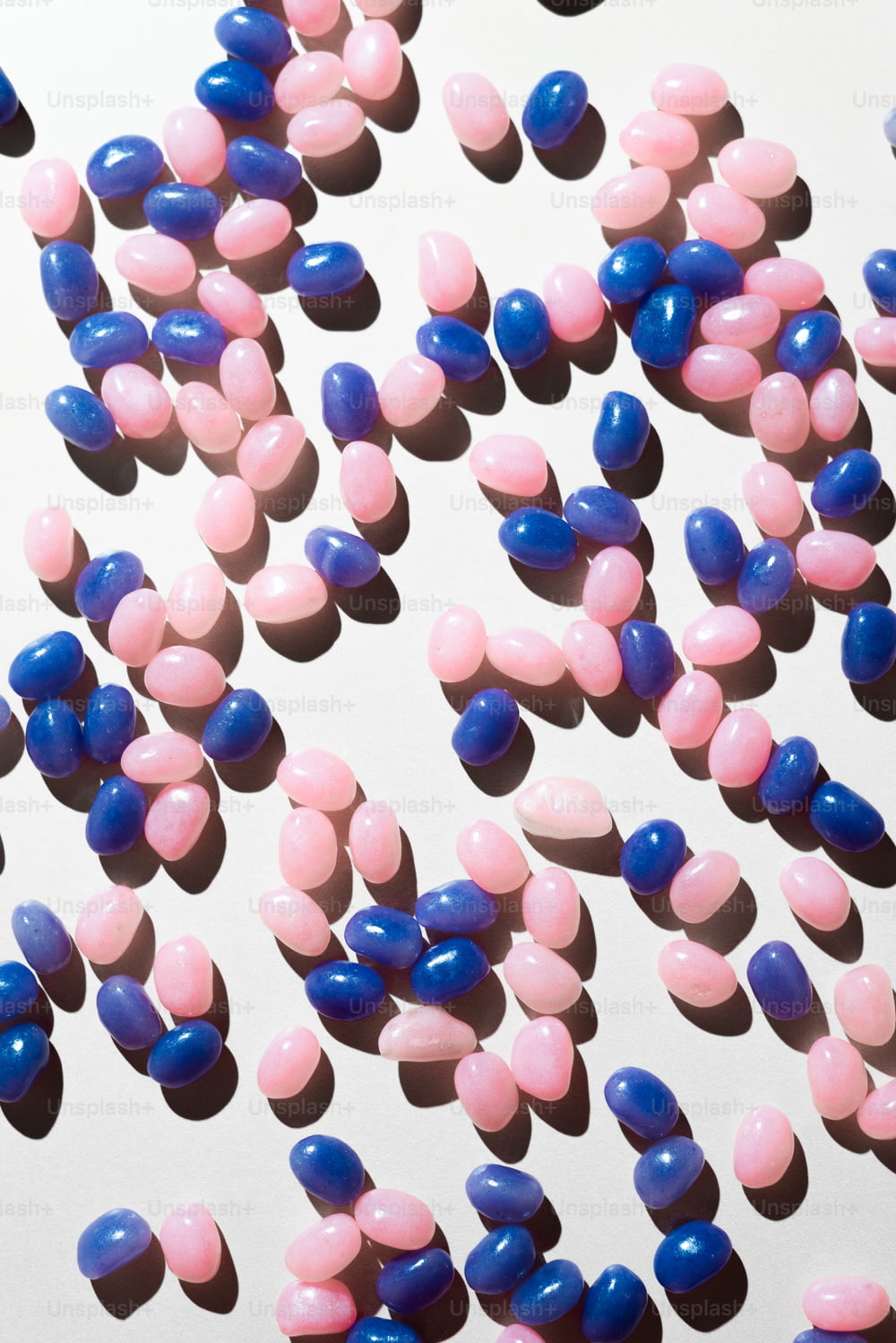 a large group of pink and blue pills