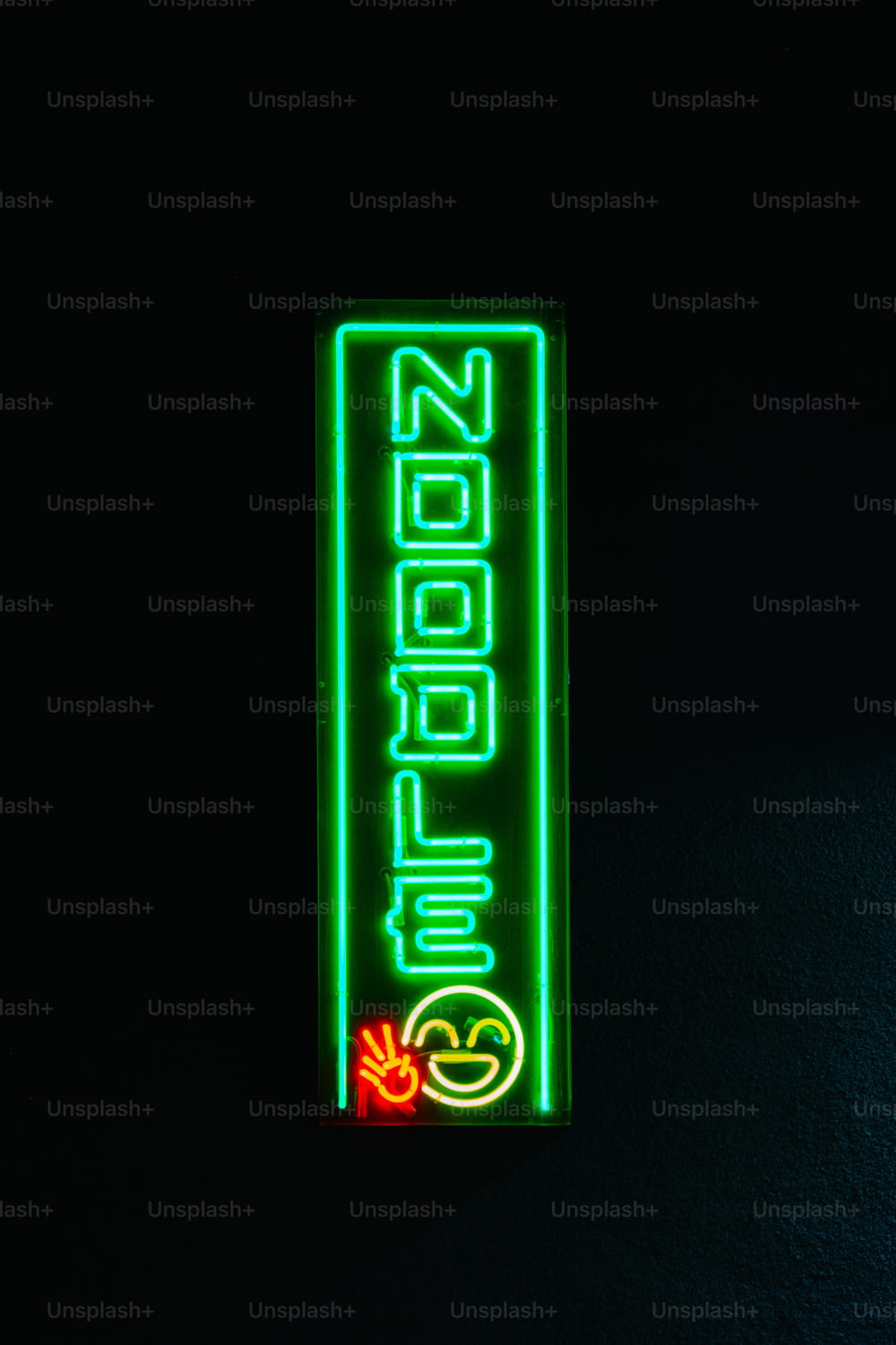 a neon sign that is on the side of a wall