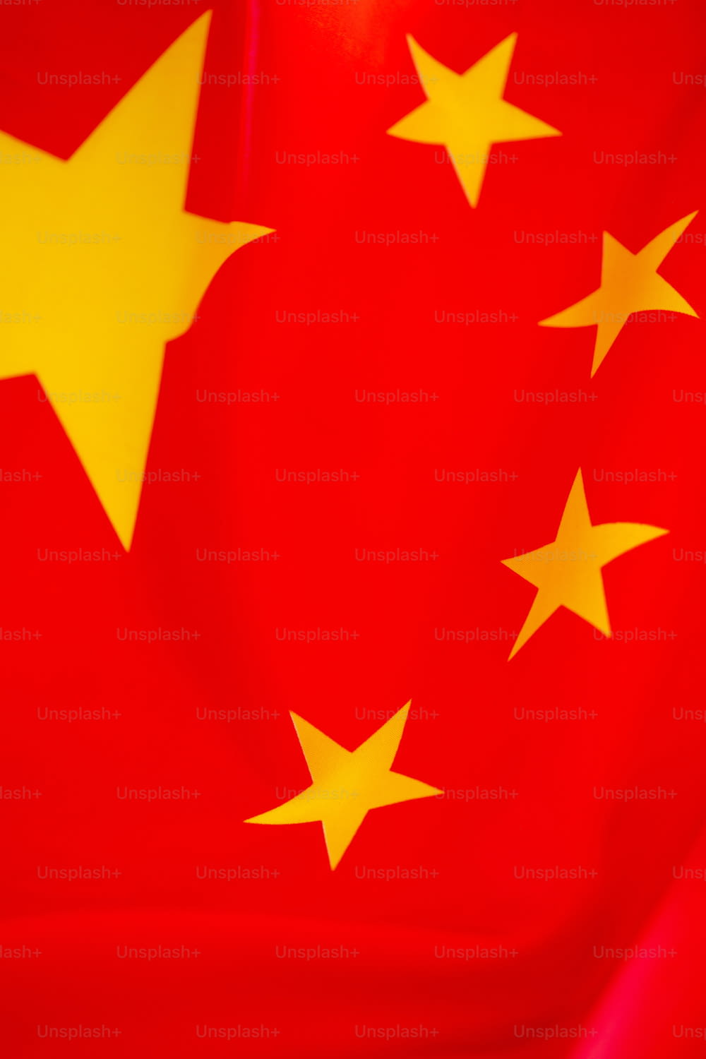 a red and yellow flag with stars on it