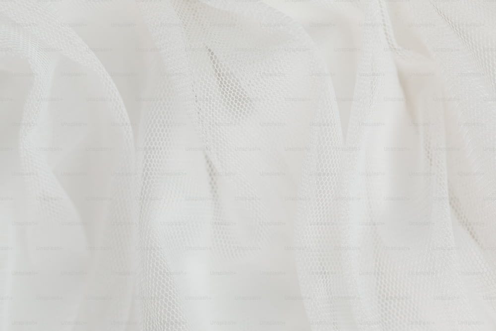 a close up of a white sheer fabric