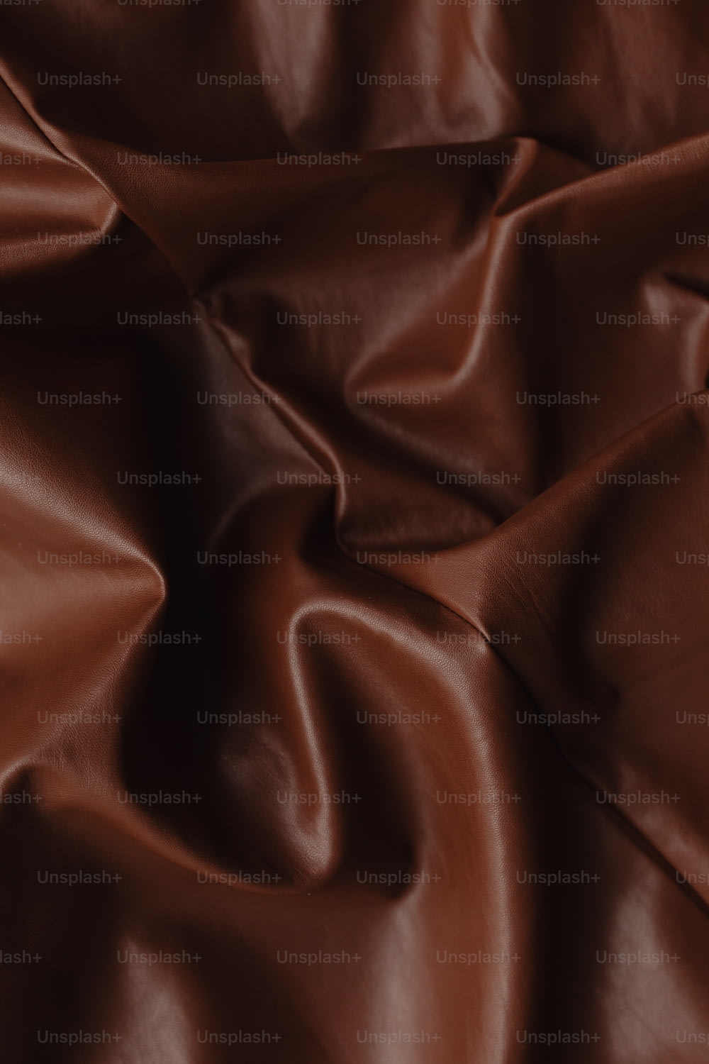 a close up of a brown leather texture