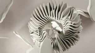 a sculpture made out of white paper on a wall