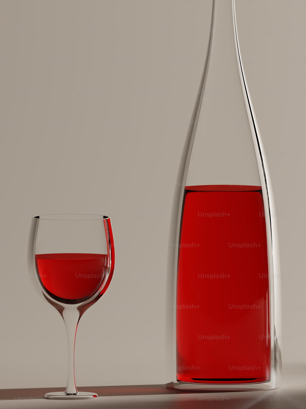 a glass of red wine next to a bottle of wine