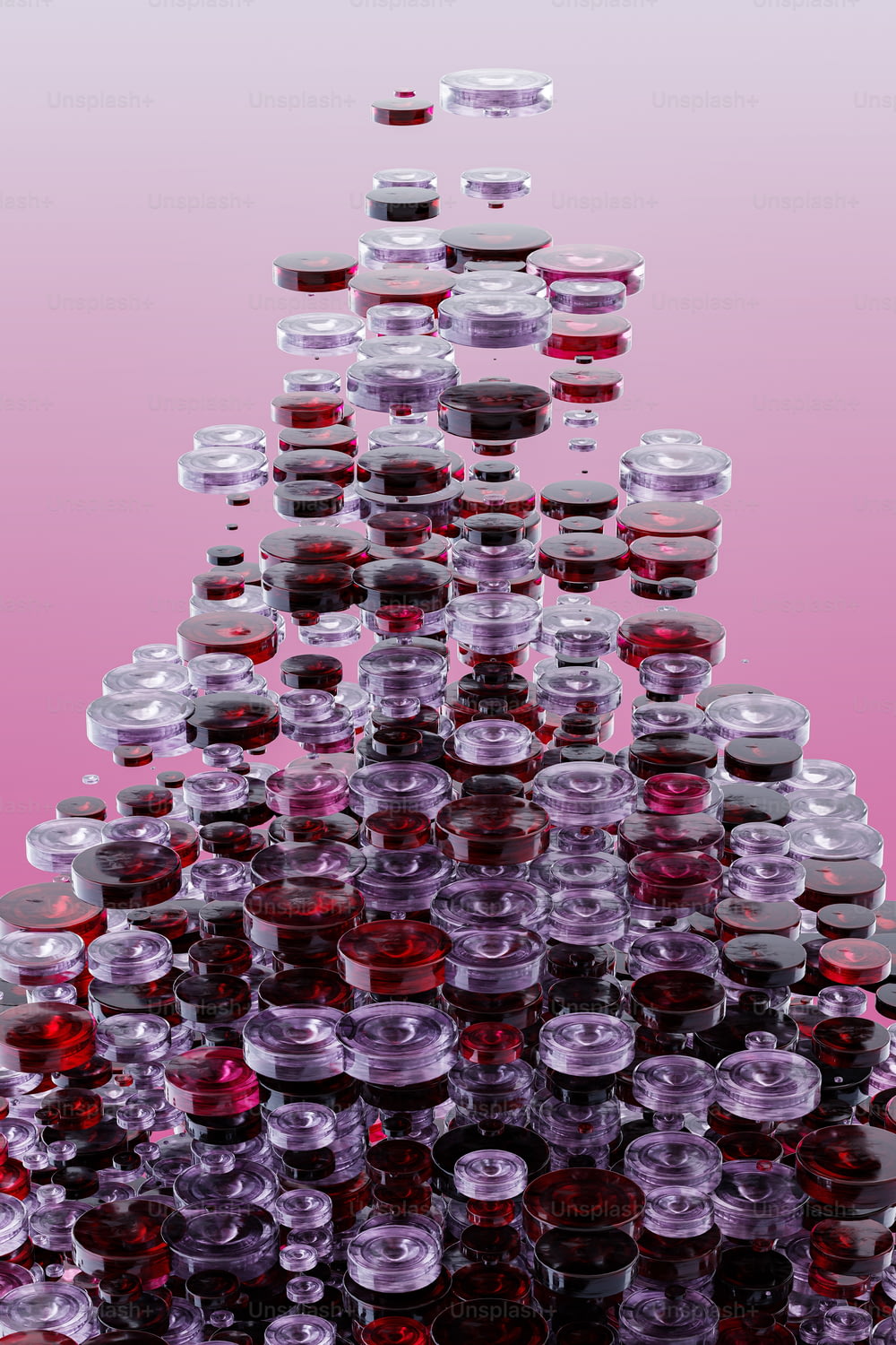 a large pile of red and purple glass objects