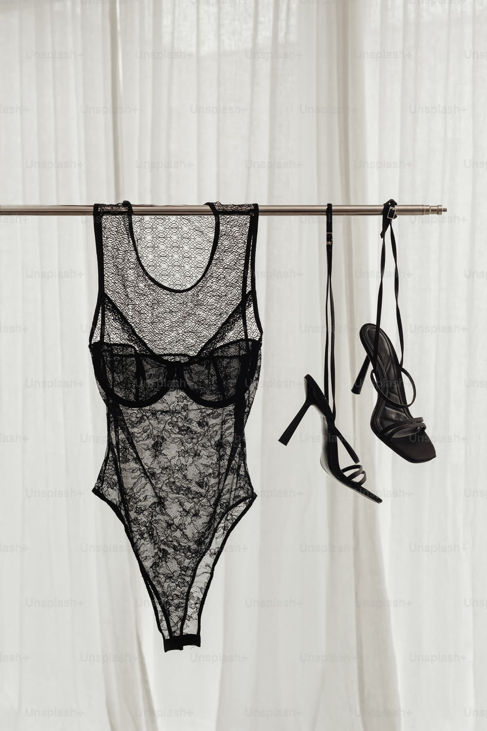 a pair of lingerie bras hanging from a clothes line