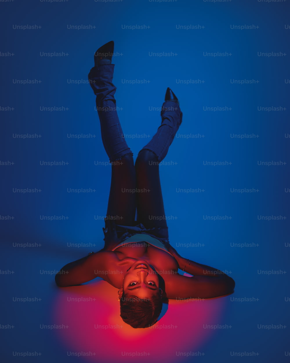 a man laying on the ground with his feet up