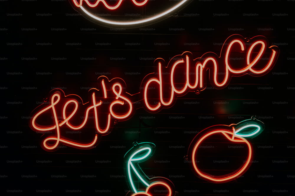 a neon sign that says let's dance