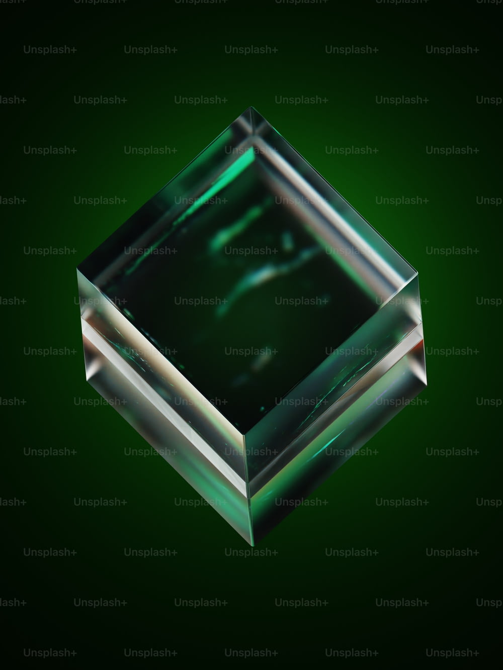 a square glass object on a green background