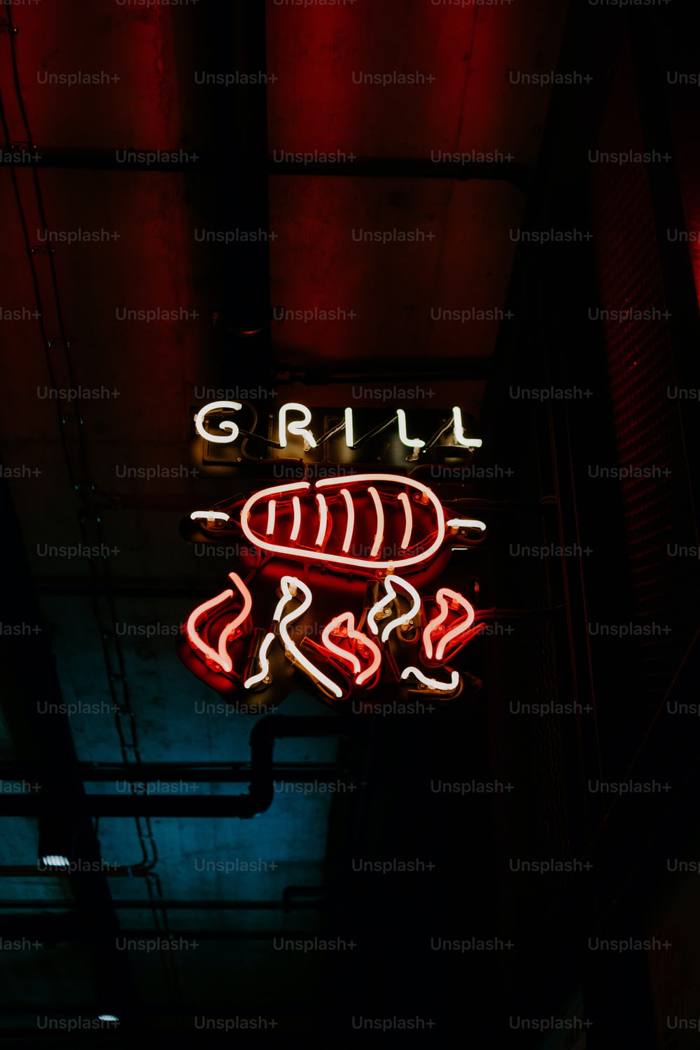 a neon sign that reads grill boss