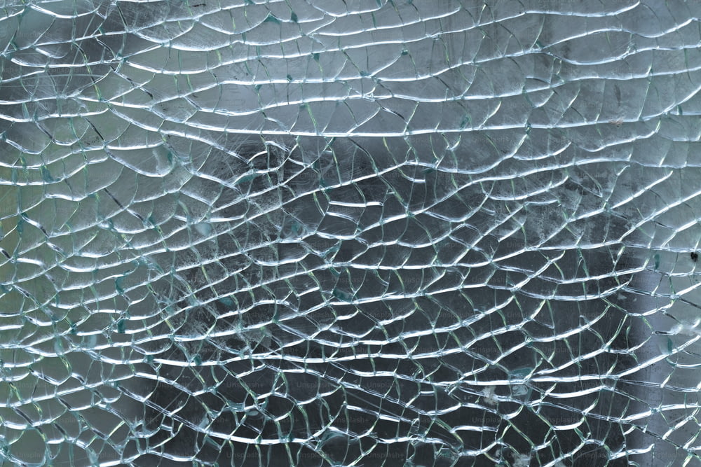 a close up of a broken glass window