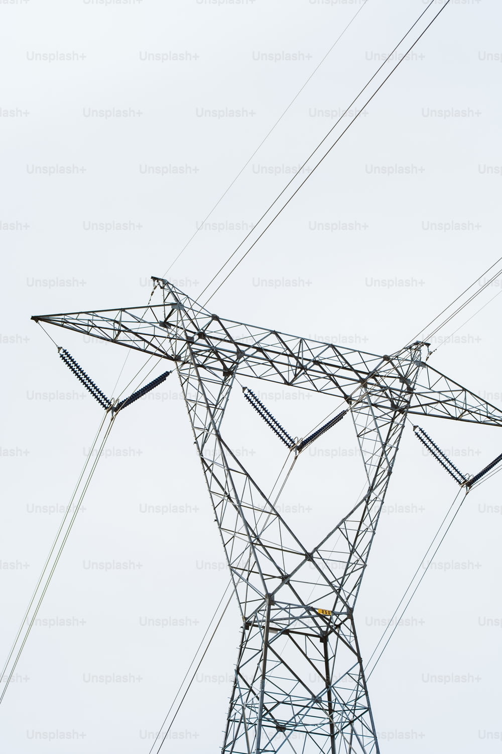 a tall electrical tower with lots of wires