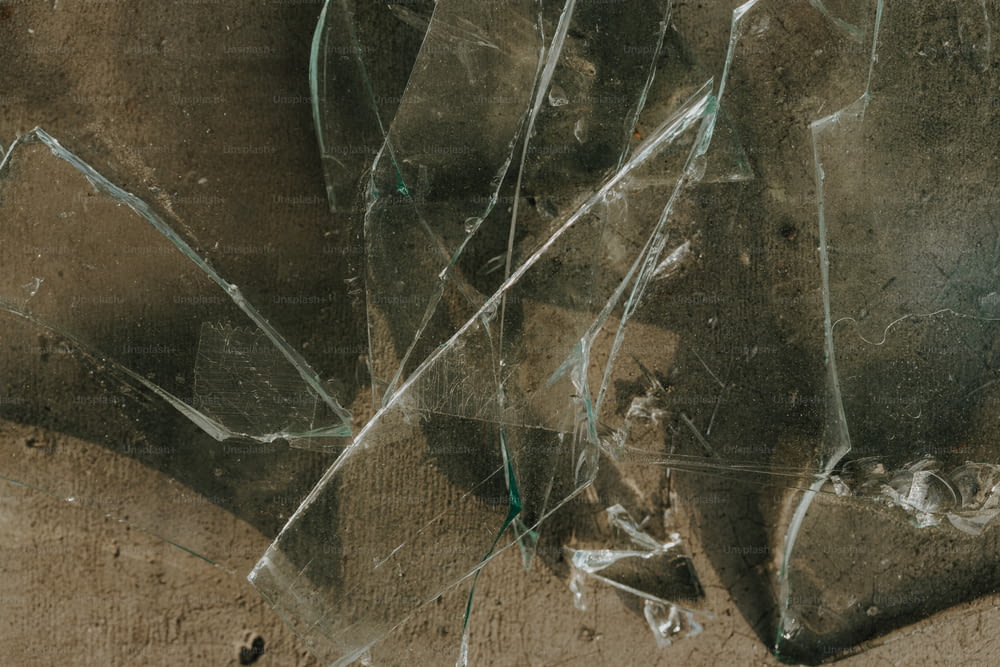 a close up of a broken glass on the ground