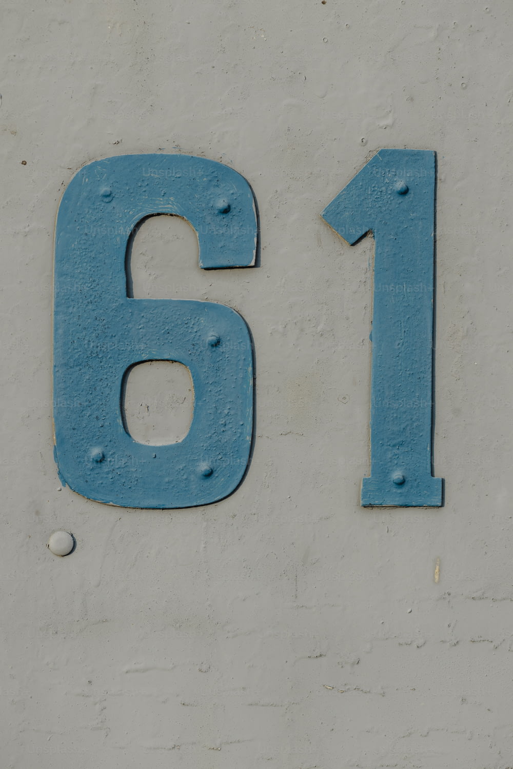 a close up of a number on a wall