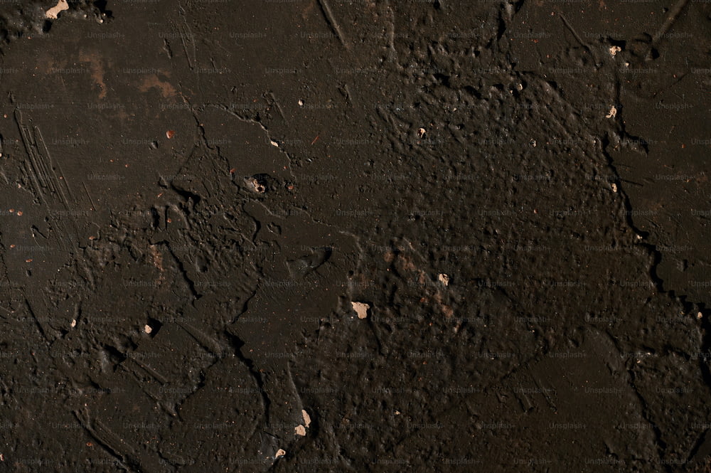 a close up of a black surface with white dots