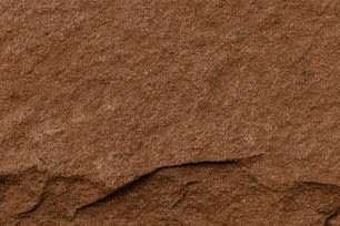 a close up of a rock with a small crack in it
