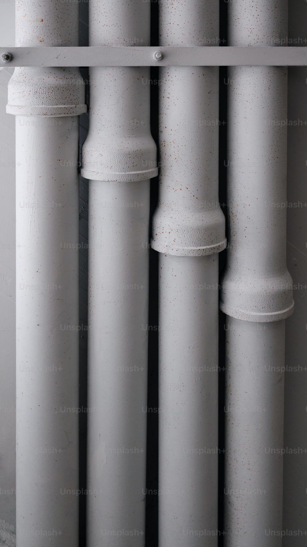a close up of a row of white pipes