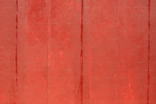 a red wall with a clock on it