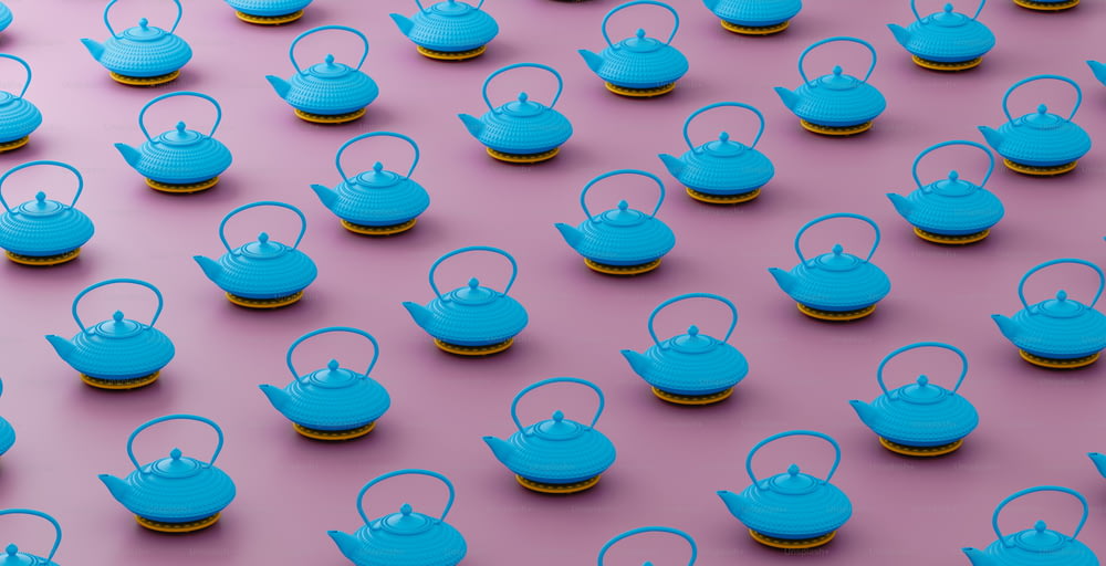 a group of blue teapots sitting on top of each other
