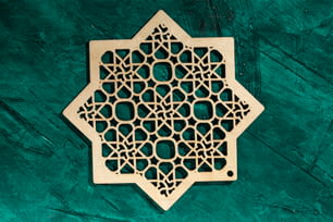 an intricate wooden design on a green background
