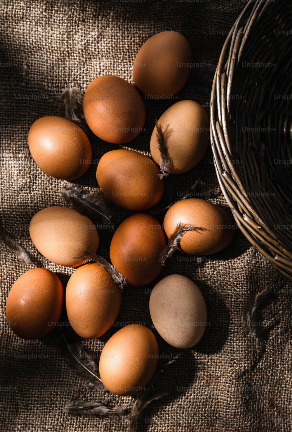 a basket of brown eggs sitting on top of a table