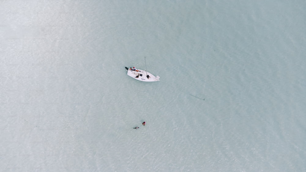 a small boat in the middle of a body of water