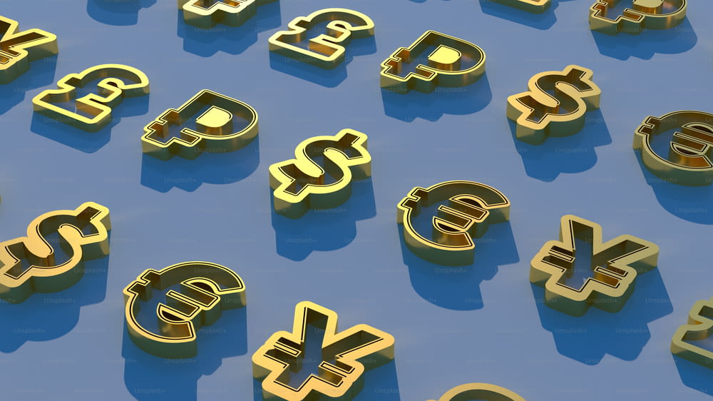 un tas de lettres dorées qui sont sur une surface bleue