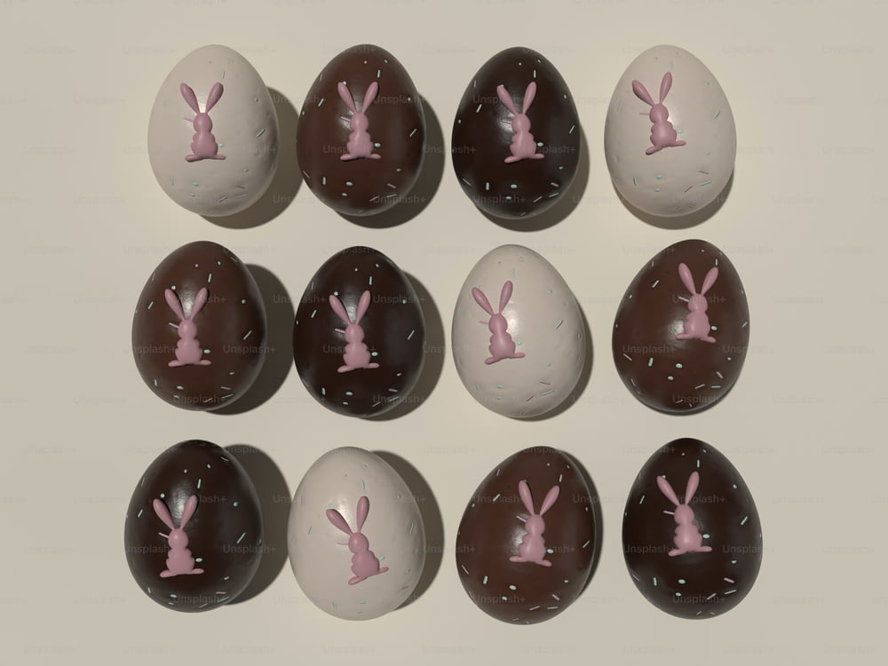 a group of chocolate eggs with pink bunny ears on them