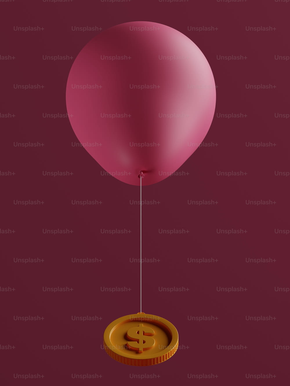 a pink balloon with a bitcoin floating in it