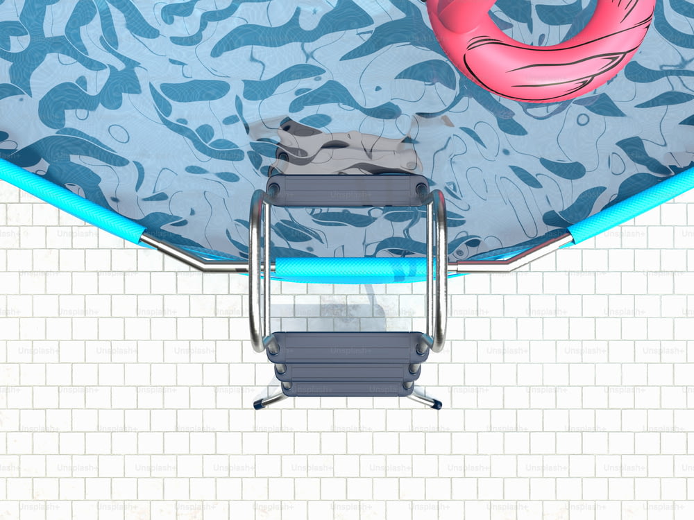 an overhead view of a swimming pool with a chair